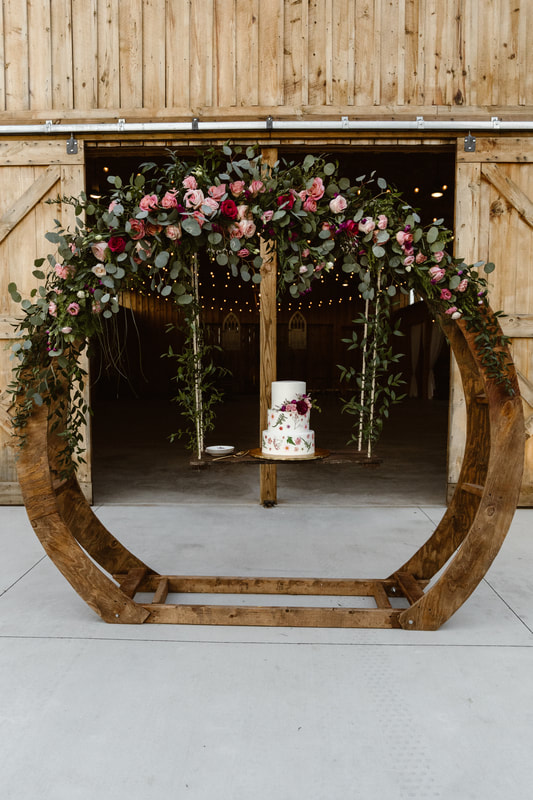 circular arbor, wood arbor, arbor flowers, burgundy pink and greenery, ceremony flowers, pinterest